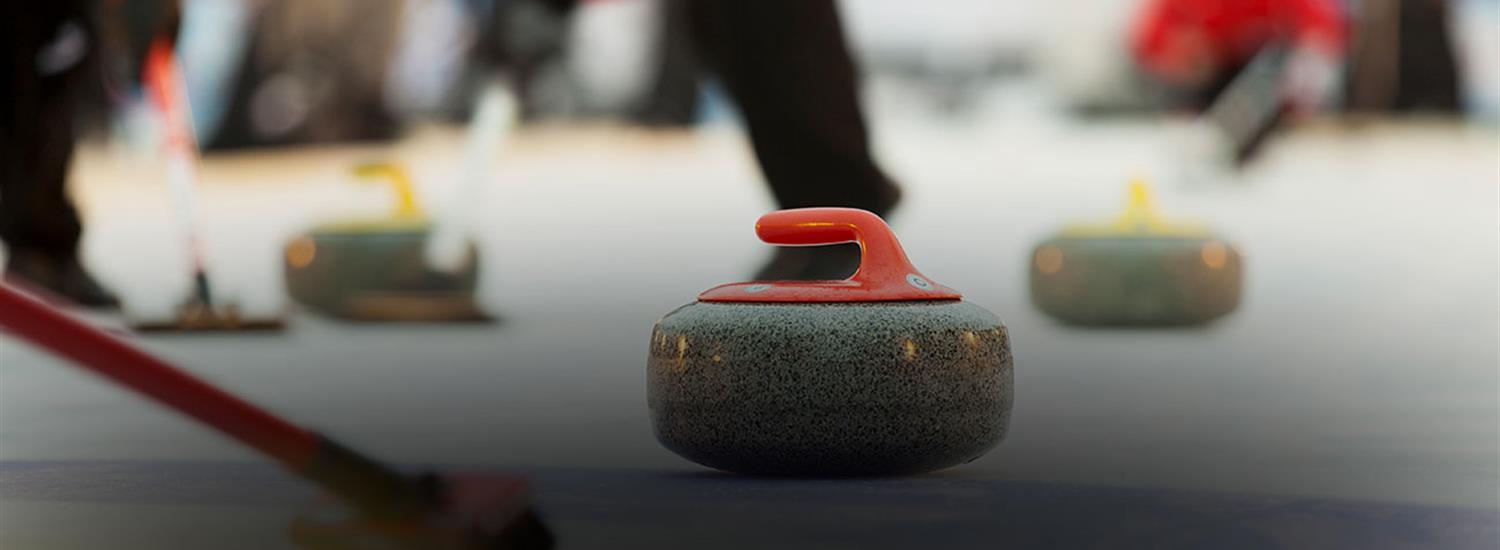 Curling rocks on ice surface